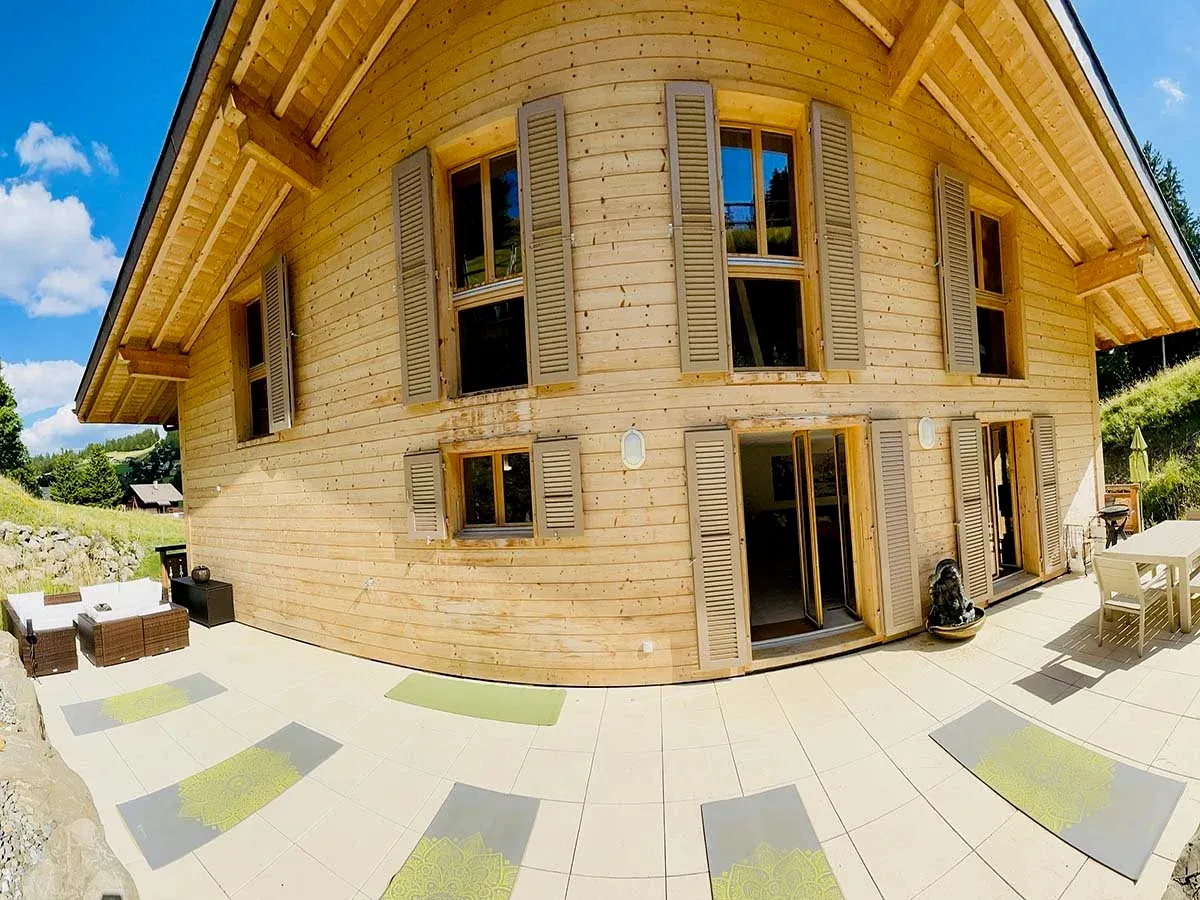 Private chalet in Les Mosses with yoga mats prepared on the terrace