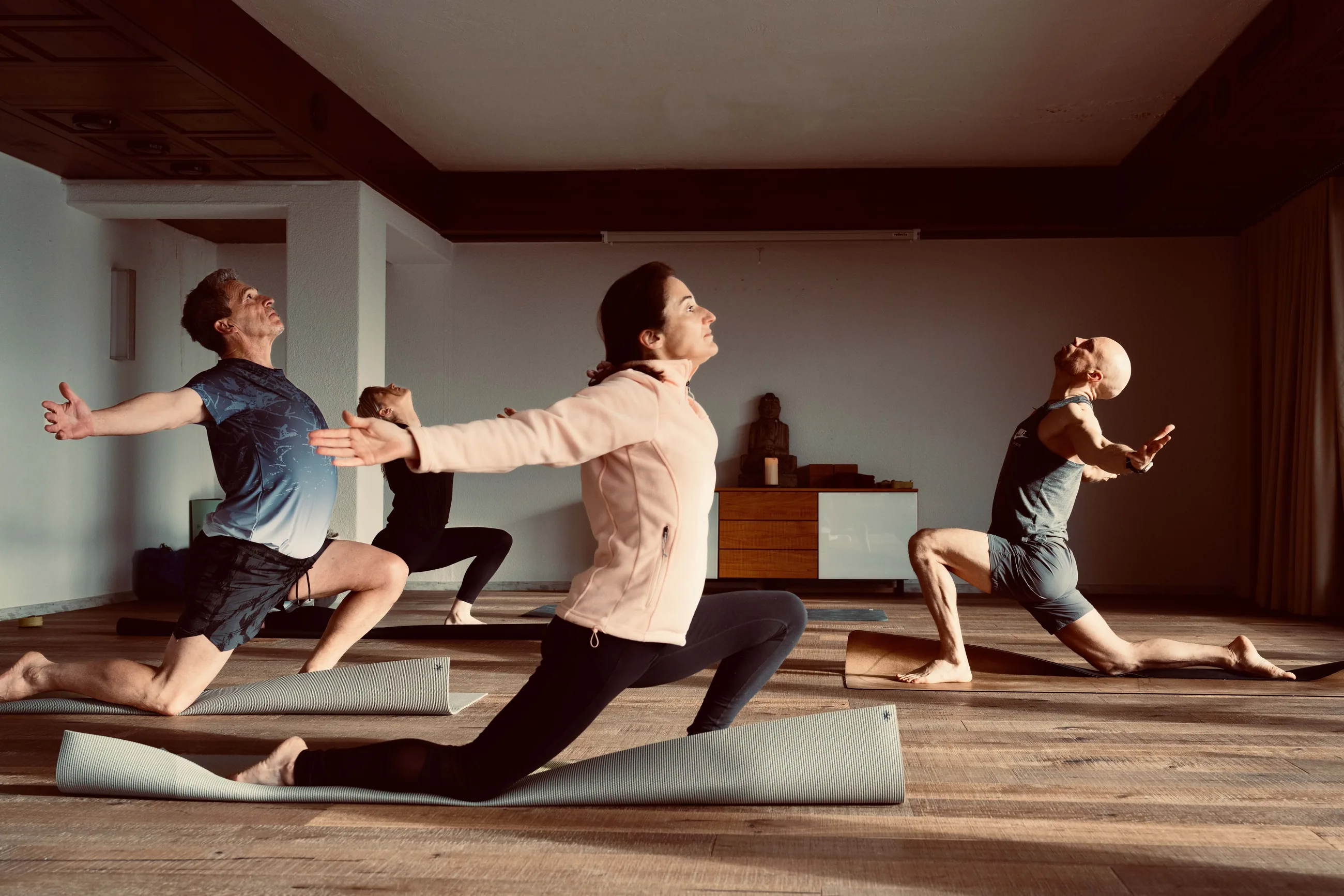 Small UNITY group practising yoga during the Ovronnaz retreat