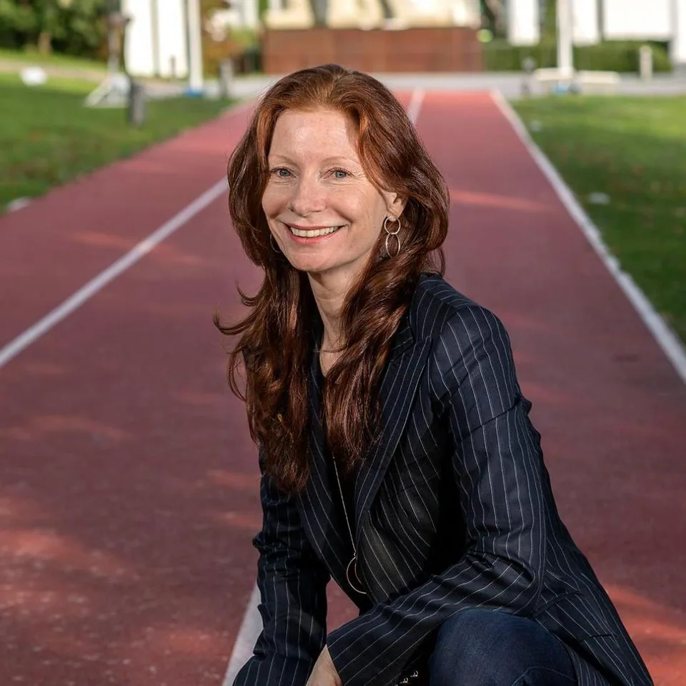 Claudia smiling outdoors