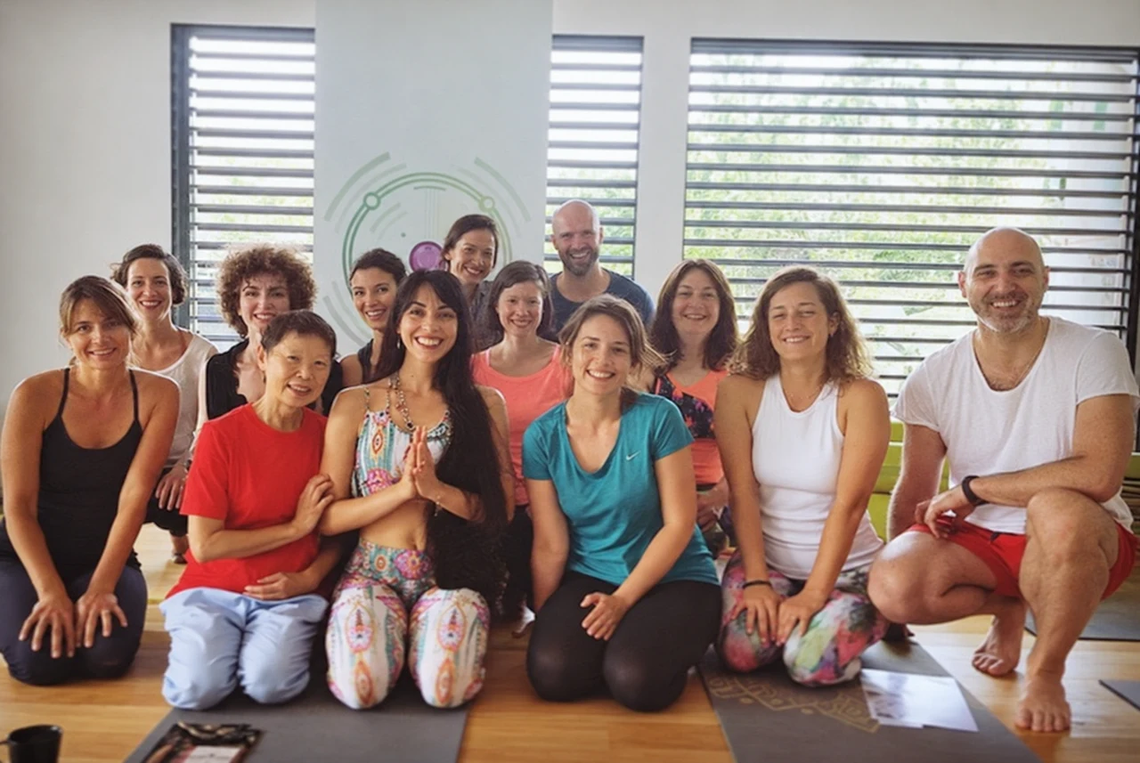 Participants smiling together after a UNITY workshop in the sunlit studio